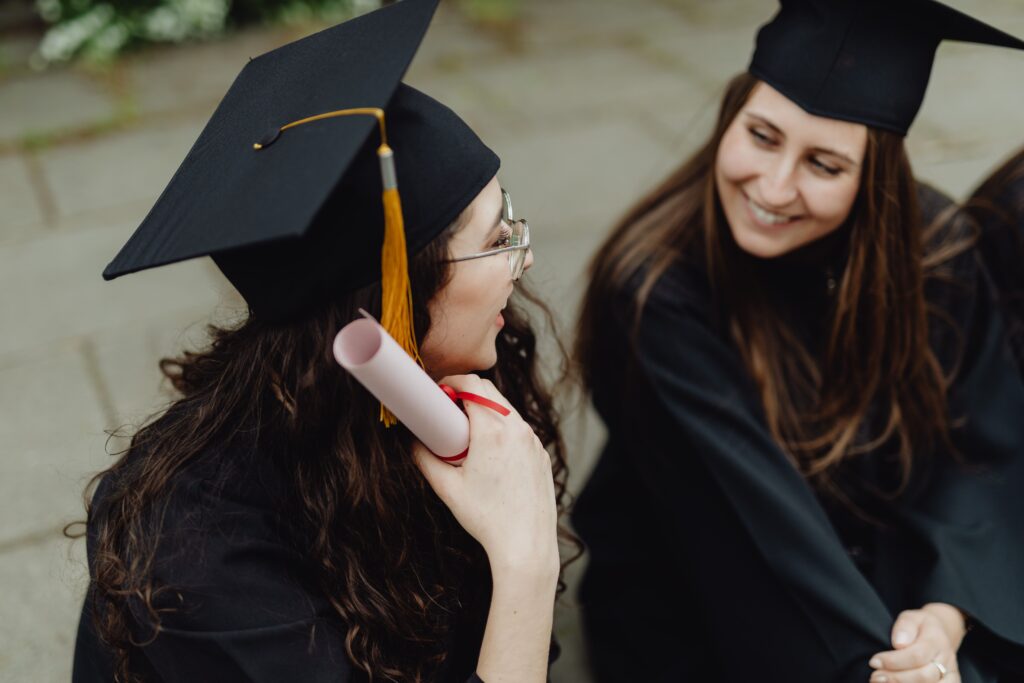 Graduates on a university campus celebrating academic achievement, representing education leadership and talent development. Livingston James provides education executive search services to universities, colleges and learning organisations across Scotland and the UK.